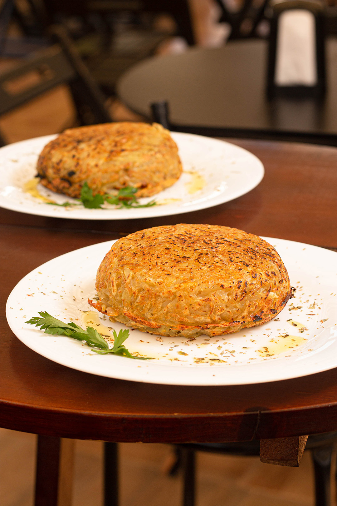 dois pratos com batata rosti